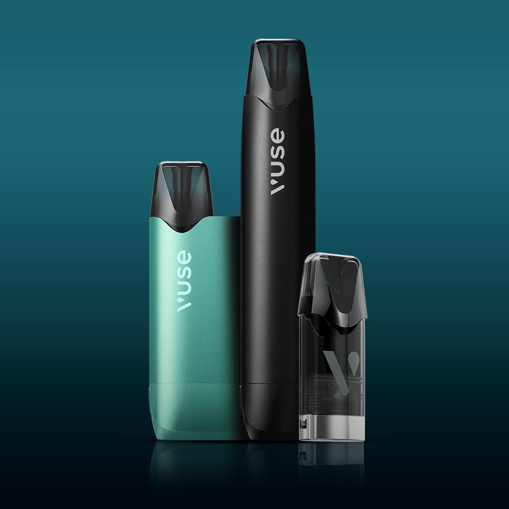 Vuse Ireland Three Vuse vaping devices and a refill pod are displayed upright on a reflective dark surface with a blue-green gradient background.