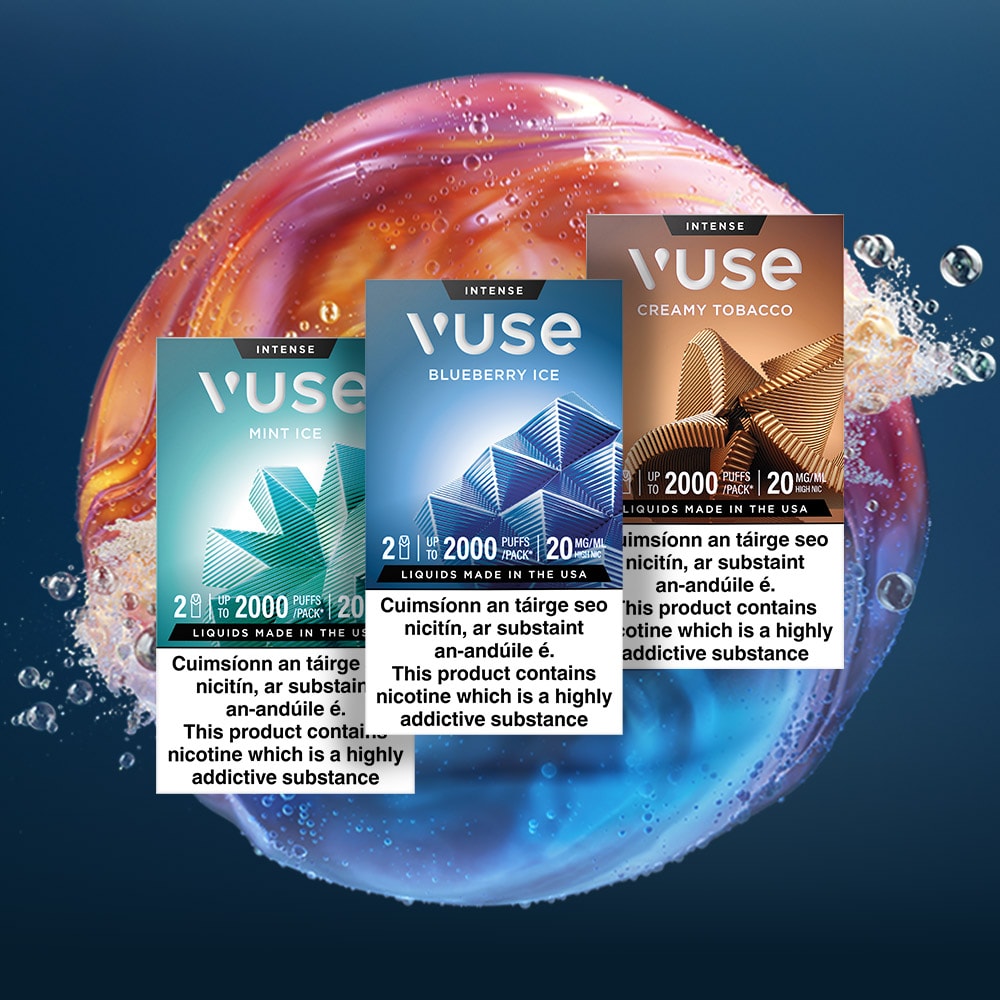 Vuse Ireland Three Vuse vape boxes—Mint Ice, Blueberry Ice, and Creamy Tobacco—are displayed in front of a colorful soap bubble with splashing water in the background.