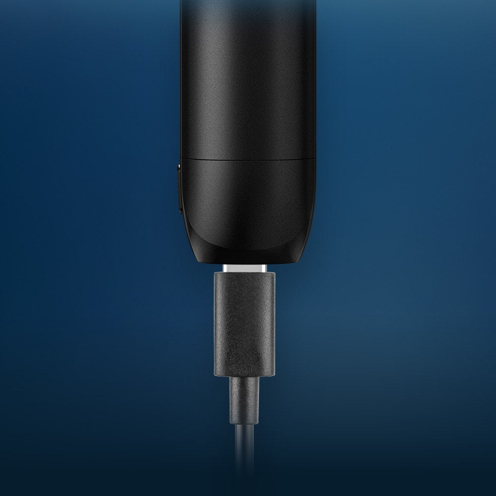 Vuse Ireland A black electronic device is being charged with a USB-C cable against a blue gradient background.