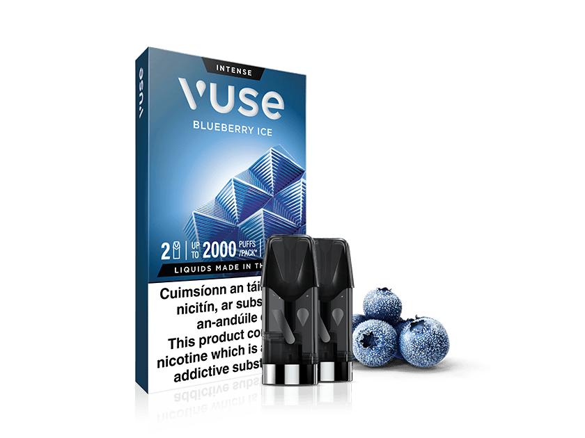 Vuse Ireland A Vuse Blueberry Ice vape pod pack is shown with two pods in front and three blueberries on the right. The packaging features blue geometric shapes and product information.