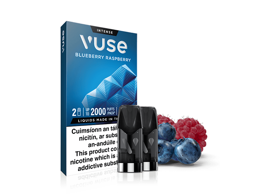 Vuse Ireland A Vuse Blueberry Raspberry vape pod pack with two pods in front and fresh blueberries and raspberries beside them. The packaging displays warnings and product details.