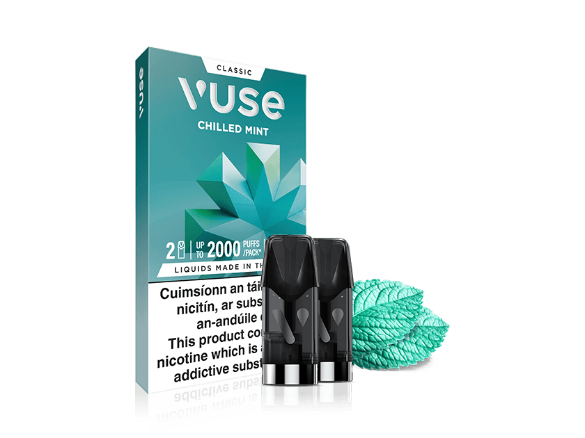 Vuse Ireland Vuse Chilled Mint vape pods box with two pods in front and mint leaves beside it. The package displays warnings and shows a geometric mint leaf design.