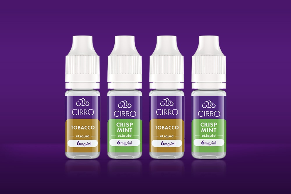 Vuse Ireland Four small bottles of CIRRO e-liquid are lined up on a purple background, labeled as Tobacco and Crisp Mint flavors, each with a nicotine strength of 6mg/ml.
