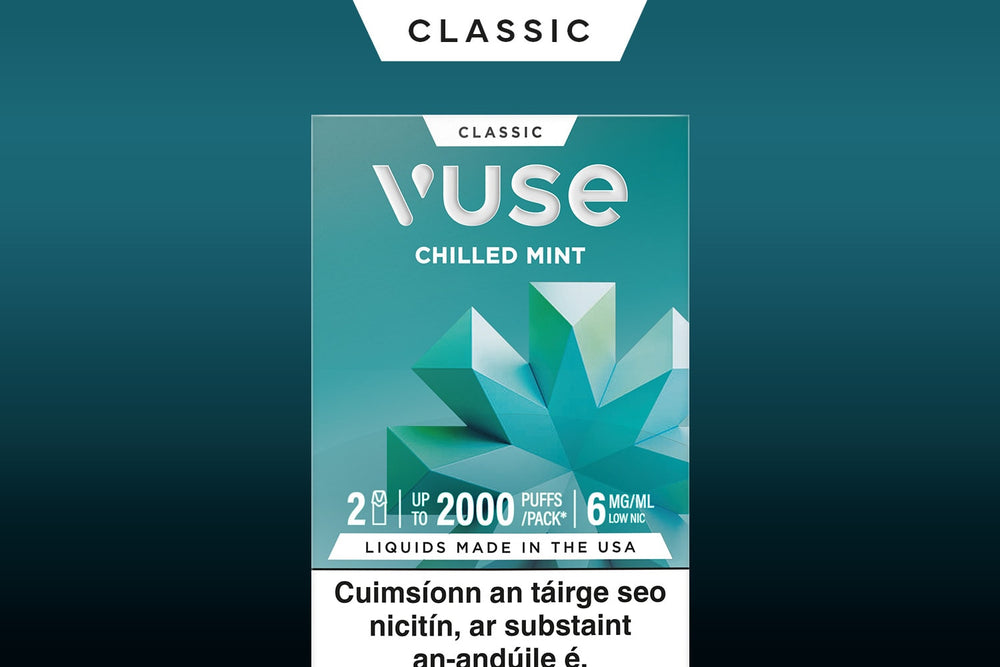 Vuse Ireland A Vuse Chilled Mint e-cigarette package with geometric mint leaf imagery, labeled Classic, up to 2000 puffs, and a nicotine warning in Irish at the bottom.
