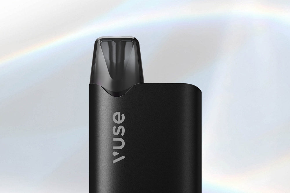 Vuse Ireland Close-up of a sleek black Vuse vape device against a soft, light gradient background with subtle rainbow-like streaks.