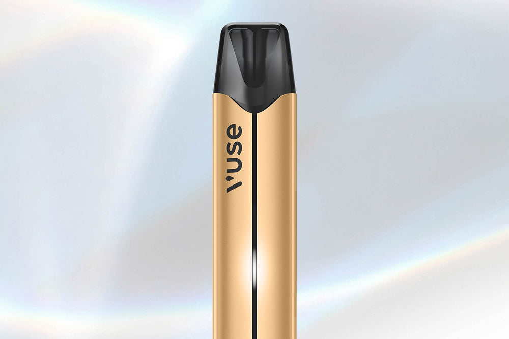 Vuse Ireland A gold and black vape pen with the word vuse printed vertically on its side, set against a soft, light-colored background.