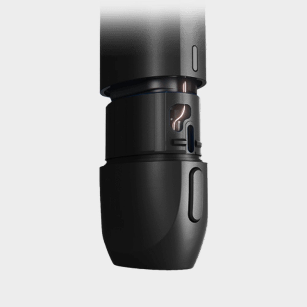 Vuse Ireland A close-up of a sleek, black, cylindrical device with a small window revealing an internal coffee bean icon and a slider, suggesting adjustable settings.