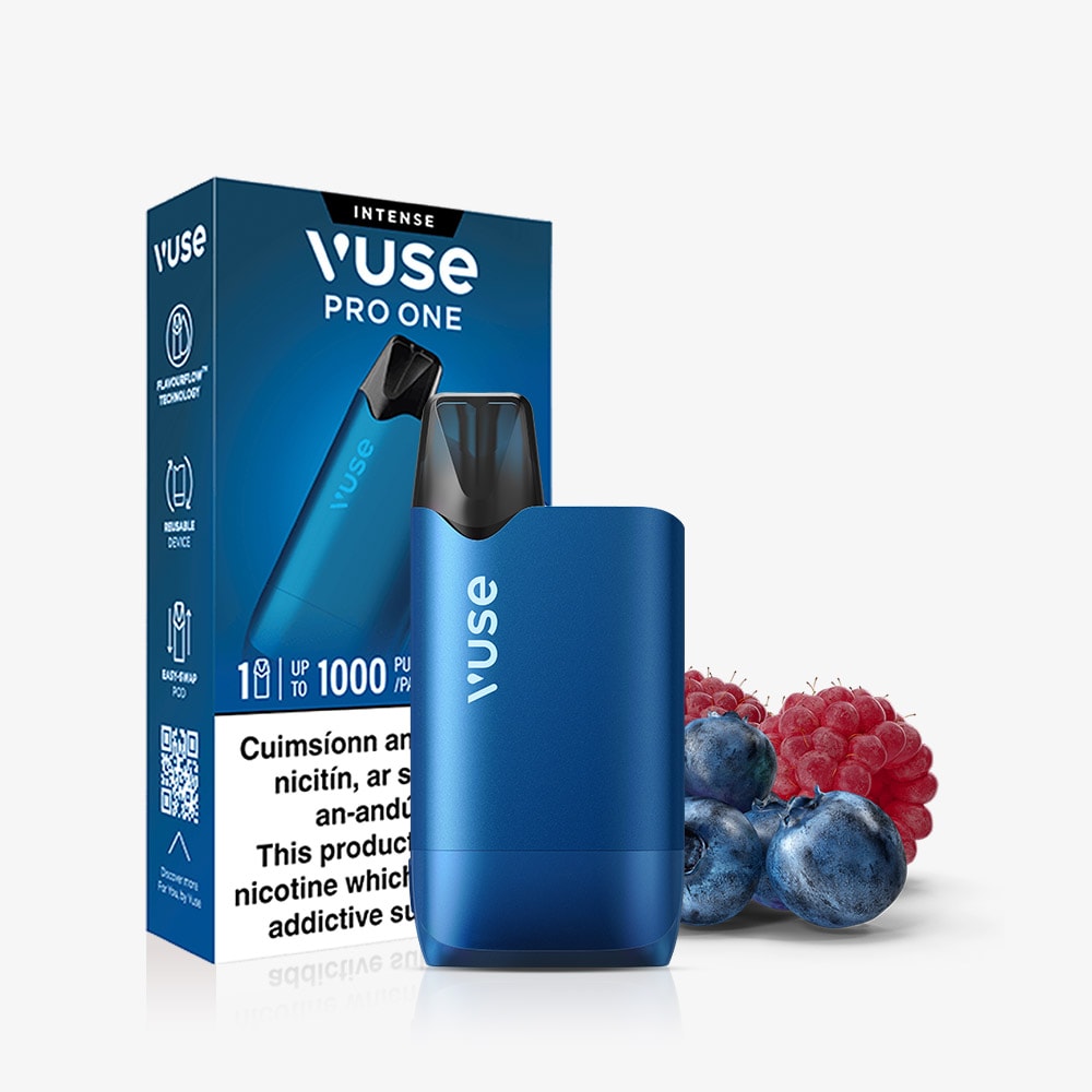 Vuse Ireland A blue Vuse Pro One Box Blueberry Raspberry rechargeable vape device stands in front of its rectangular product box, next to a small pile of blueberries and raspberries.