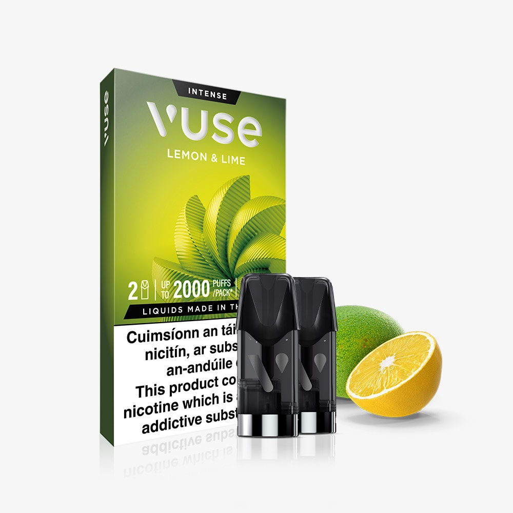 VUSE Lemon & Lime Extra Intense vape pods box with two VUSE Pods in front, shown beside a whole lime and a sliced lemon on a white background. This vibrant blend of lemon and lime is enhanced with nic salts for an extra smooth vaping experience. The warning label appears at the bottom of the packaging.