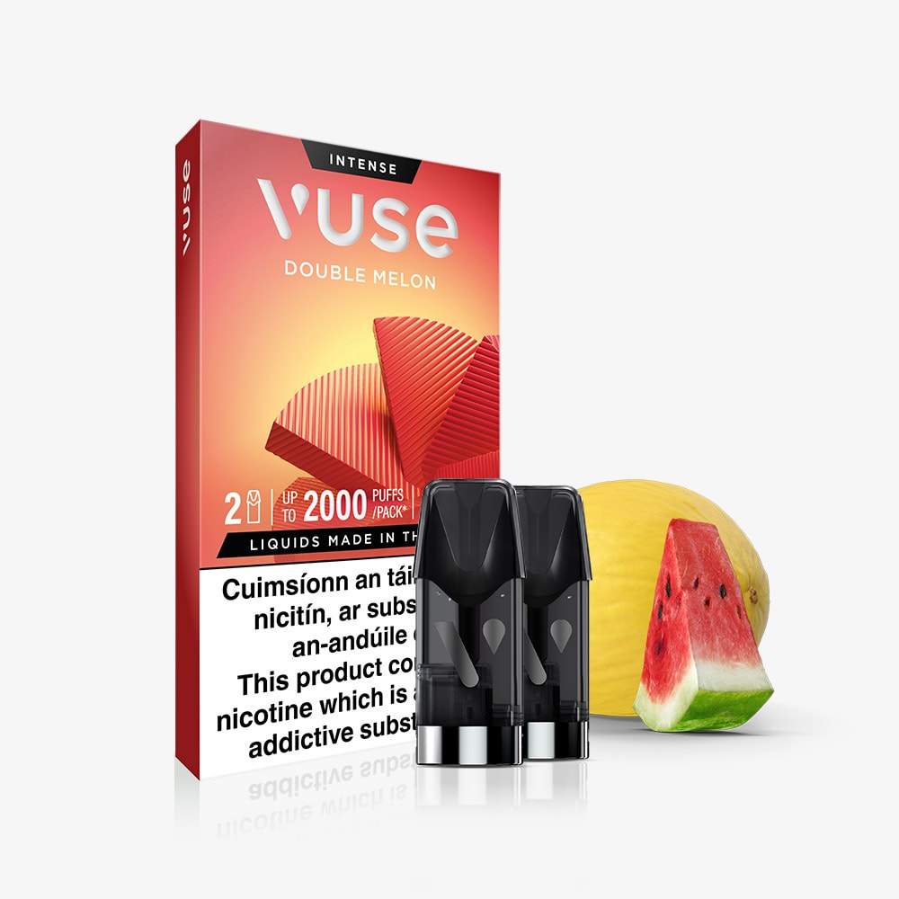 Vuse Ireland A box of VUSE Double Melon Extra Intense vape pods is displayed with two VUSE pre-filled e-liquid pods in front, positioned next to a whole yellow melon and a watermelon slice. These VUSE Double Melon Extra Intense pods are made with nic salts for a smooth vaping experience. The packaging features a nicotine warning label.