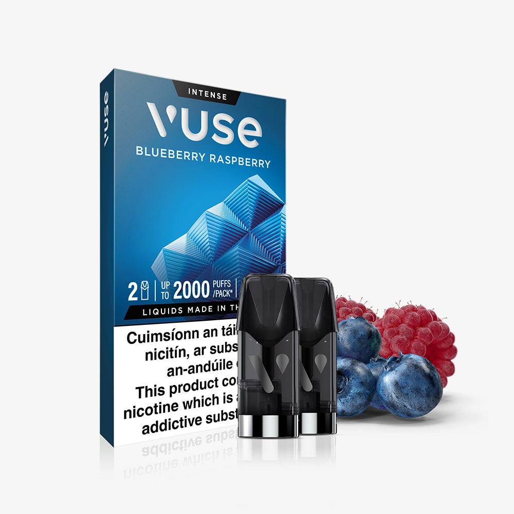 VUSE Pod Blueberry Raspberry Extra Intense pack with two black VUSE PRO pods is displayed in front of fresh blueberries and raspberries. The blue packaging features the product name, flavor, and a warning about nicotine addiction. These pre-filled e-liquid pods offer a convenient and flavorful vaping experience for fans of Blueberry Raspberry flavors.