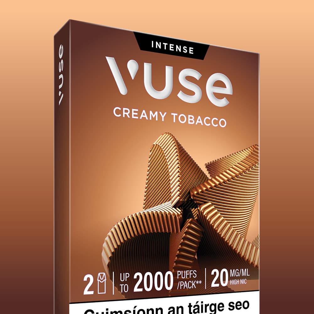 Vuse Ireland Rectangular packaging for the VUSE Pod Creamy Tobacco Extra Intense features a bronze spiral design and an INTENSE label, with details stating up to 2000 puffs per pack and 20 mg/ml nicotine strength. The box emphasizes compatibility with Vuse PRO pre-filled e-liquid pods, and partially visible text in another language appears at the bottom.