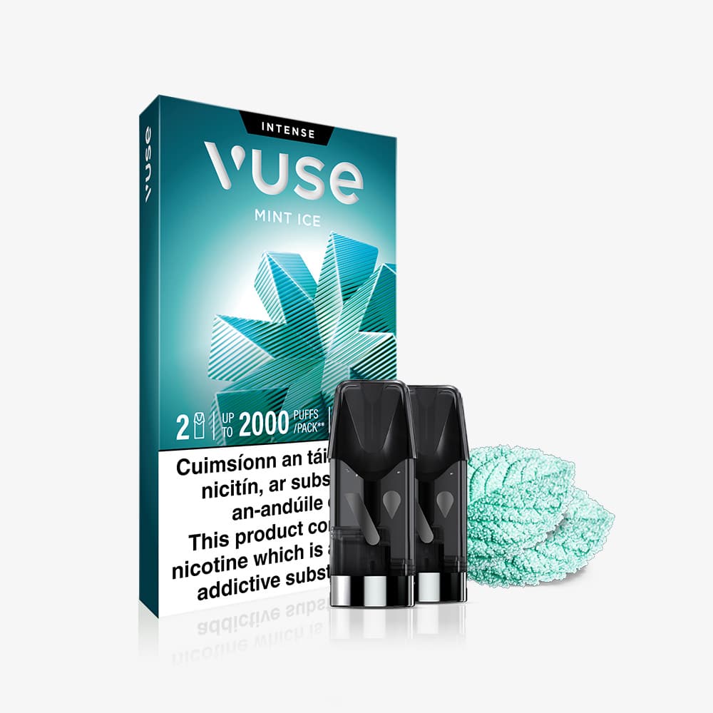 Vuse Ireland A box of VUSE Pod Mint Ice Extra Intense with two pre-filled e-liquid pods displayed in front beside two mint leaves. A warning label about nicotine in English and Irish is visible on the VUSE Pods packaging.
