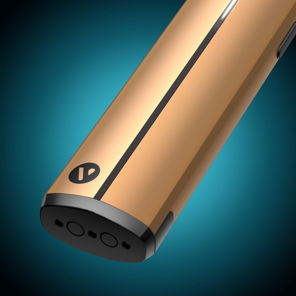 Vuse Ireland A close-up of the VUSE Vuse Pro Device Kit showcases its sleek gold finish with a distinctive black stripe and button accents, set against a blue gradient background. This fast-charging device offers a stylish and convenient solution for modern vaping.