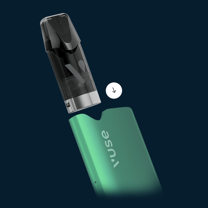 Vuse Ireland A close-up of a green Vuse vape device with its black cartridge being inserted, shown against a dark blue background with a white downward arrow indicating the assembly direction.