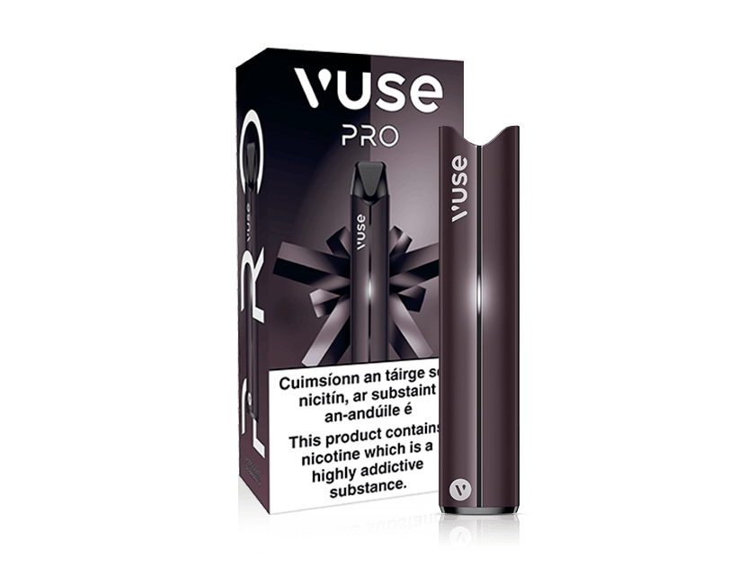 A VUSE Pro Device Kit stands in front of its packaging, which shows the product name and a health warning stating that nicotine is highly addictive. The sleek, dark-colored device, designed by VUSE, offers fast charging and modern convenience.