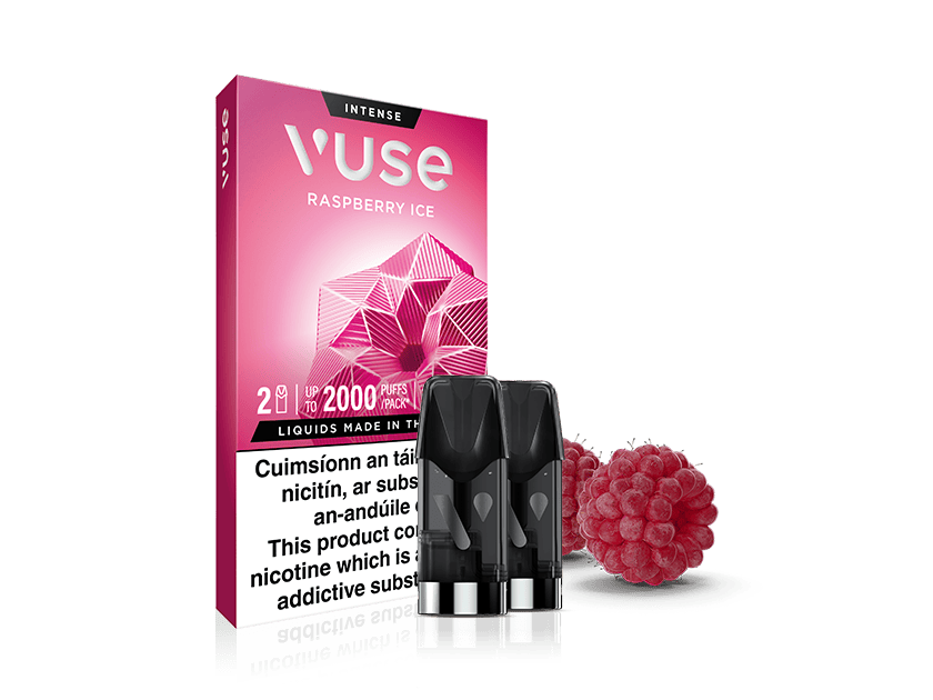 Vuse Ireland Vuse Raspberry Ice vape pod packaging with two pods in front, a geometric raspberry graphic, and two real raspberries beside the box. Warning label present on the packaging.