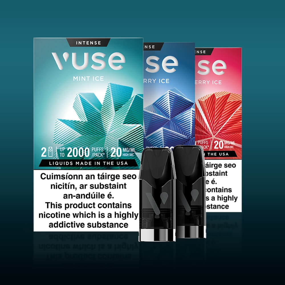 Vuse Ireland Three Vuse vape cartridge boxes—Mint Ice, Berry Ice, and Strawberry Ice—stand behind two vape pods, with a nicotine warning label in English and Irish at the bottom.