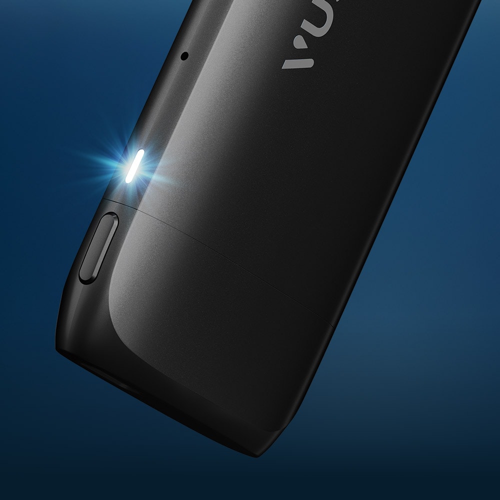 Vuse Ireland Close-up of a sleek black electronic device with a small glowing LED light, set against a dark blue background.